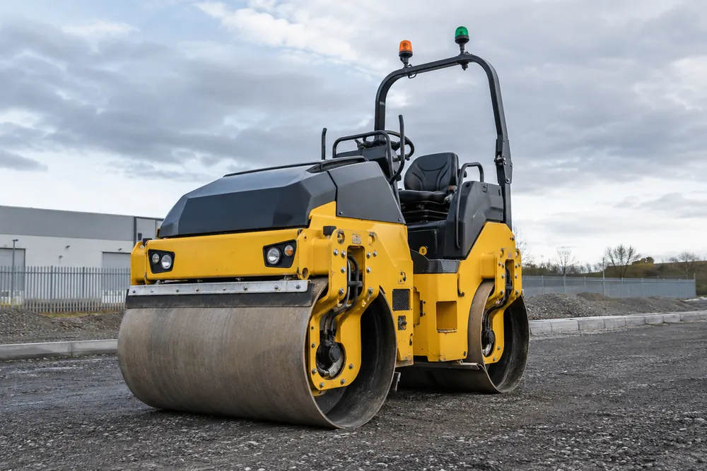 Tandem compaction roller on an aggregate base
